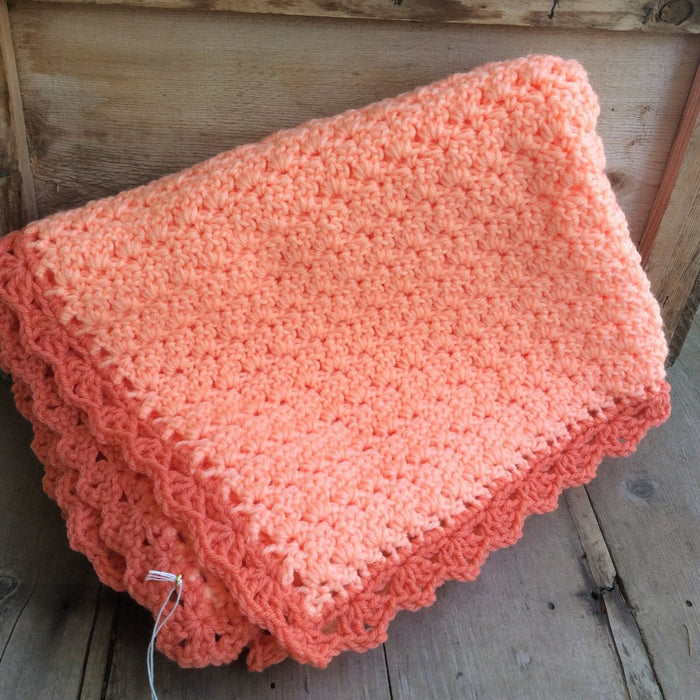 Crocheted blanket coral pink